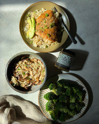 Three plates of food and one jar of Shared Cultures Lion's Mane Mushroom Miso