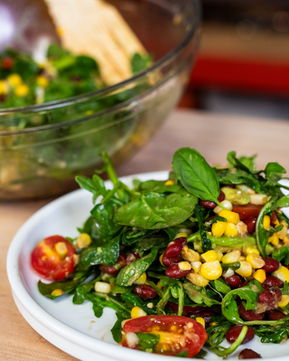 Plate of fresh mixed tomato and corn salad.