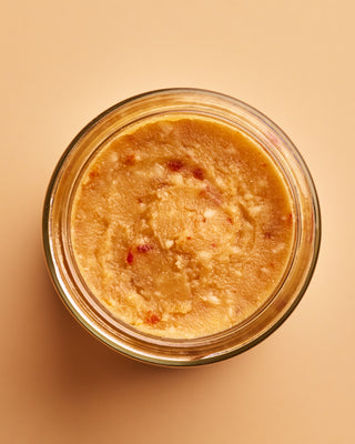Open jar of tomato miso