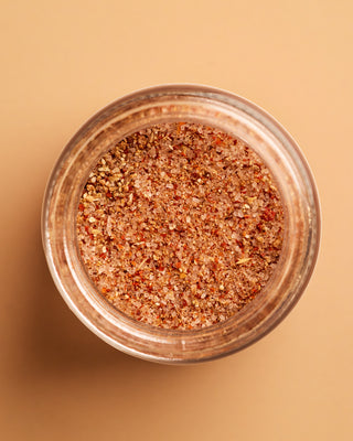 Open jar of Calabrian chili lemon salt