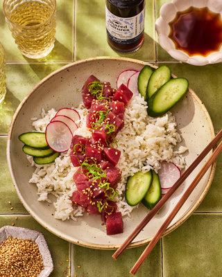 Yuzu Tuna Poke Bowl and a bottle of Shared Cultures Lentil Quinoa Shoyu